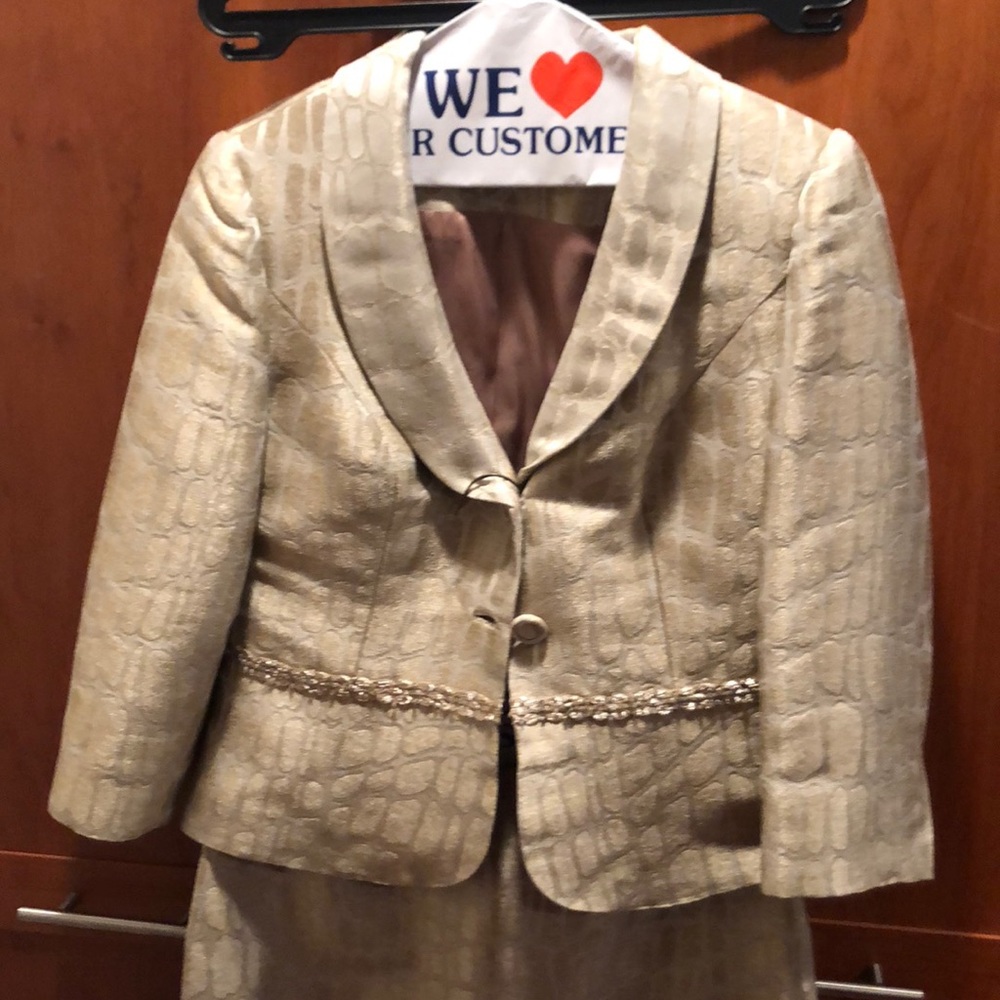 Skirt suit with jacket by designer Kay Unger.